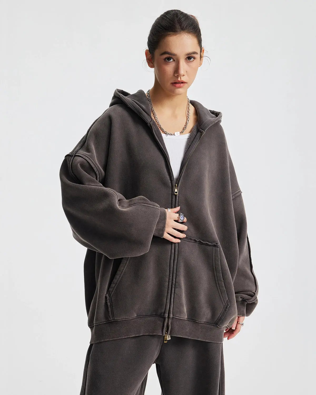 Distressed acid wash double zip-up hoodie by Flation Streetwear, showing the front view with zippers and worn fabric details.