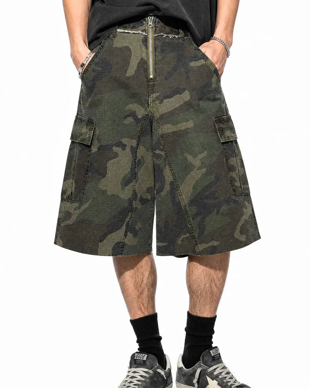 Camouflage utility longline shorts by INFLATION featuring a relaxed fit, multiple pockets, and a trendy streetwear style.