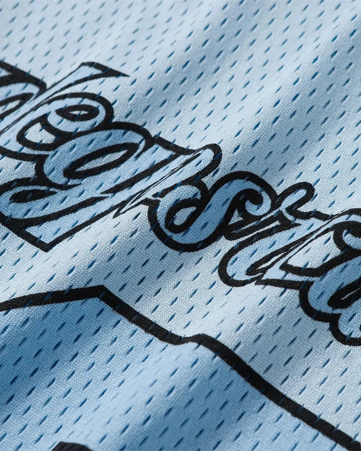 Flation Mesh Patchwork Oversized Jersey featuring a colorful, breathable fabric design with a relaxed streetwear fit.