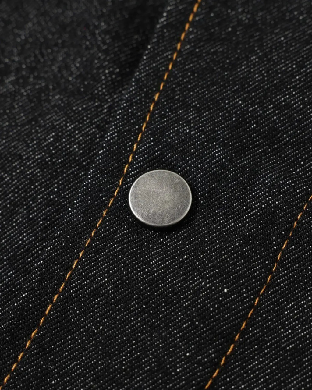 Metal toggle raw denim jacket by Flation Streetwear featuring metal buttons and rugged raw denim fabric.