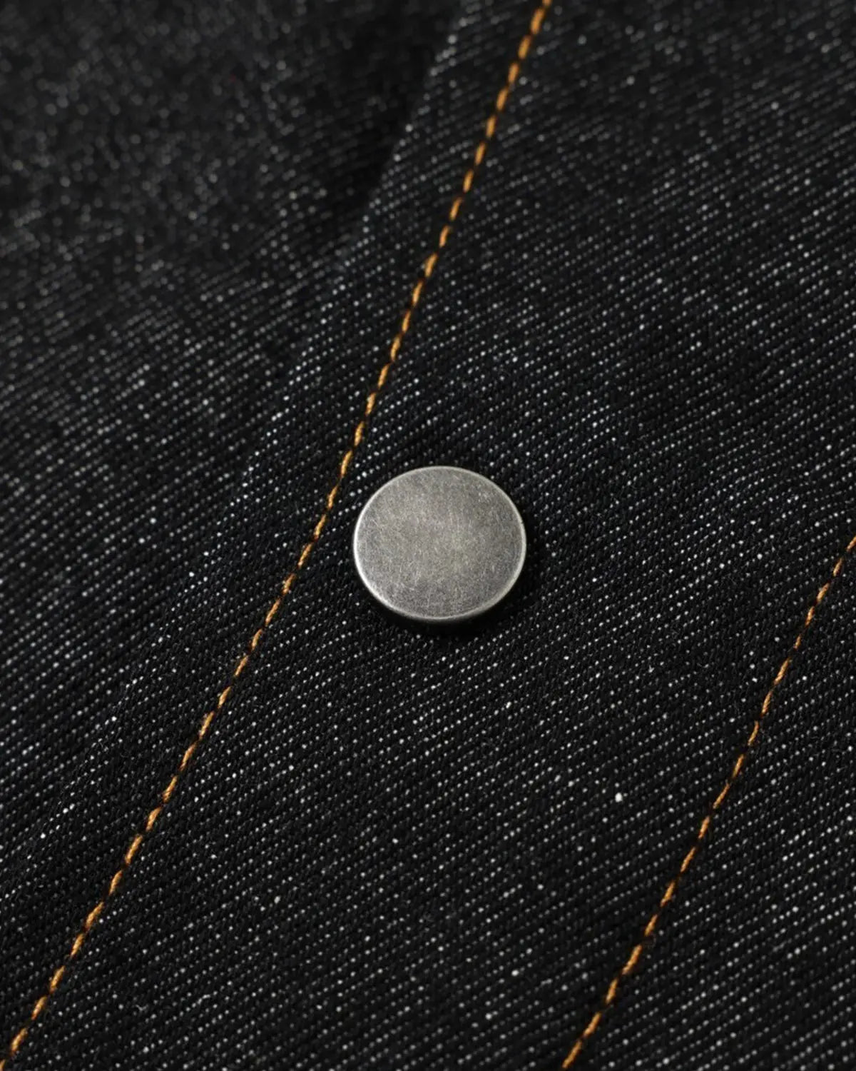 Metal toggle raw denim jacket by Flation Streetwear featuring metal buttons and rugged raw denim fabric.