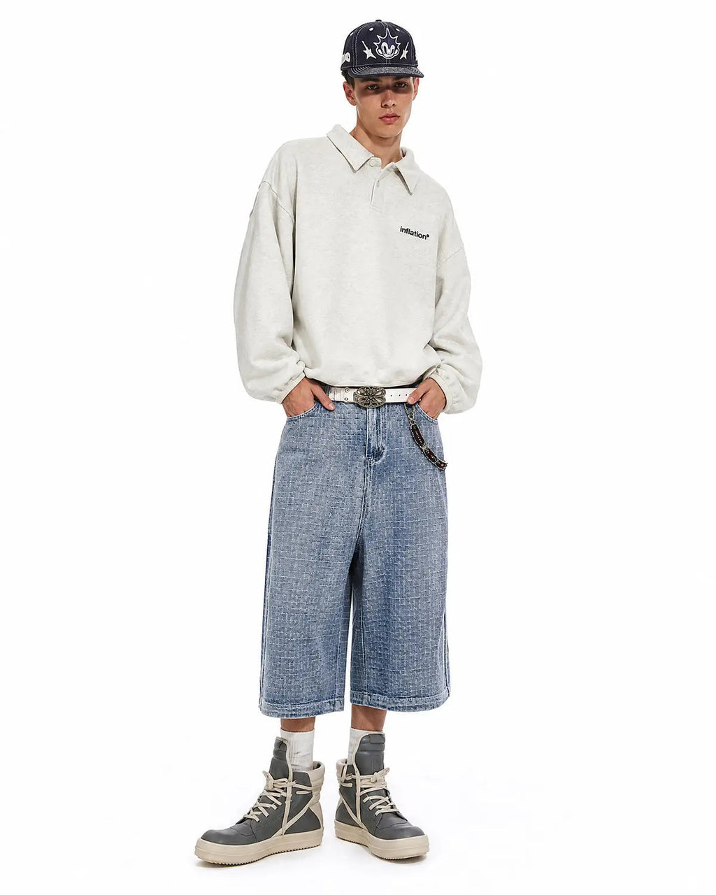 Baggy jorts with grid texture from Inflation Streetwear, showing the relaxed fit and stylish distressed denim design.