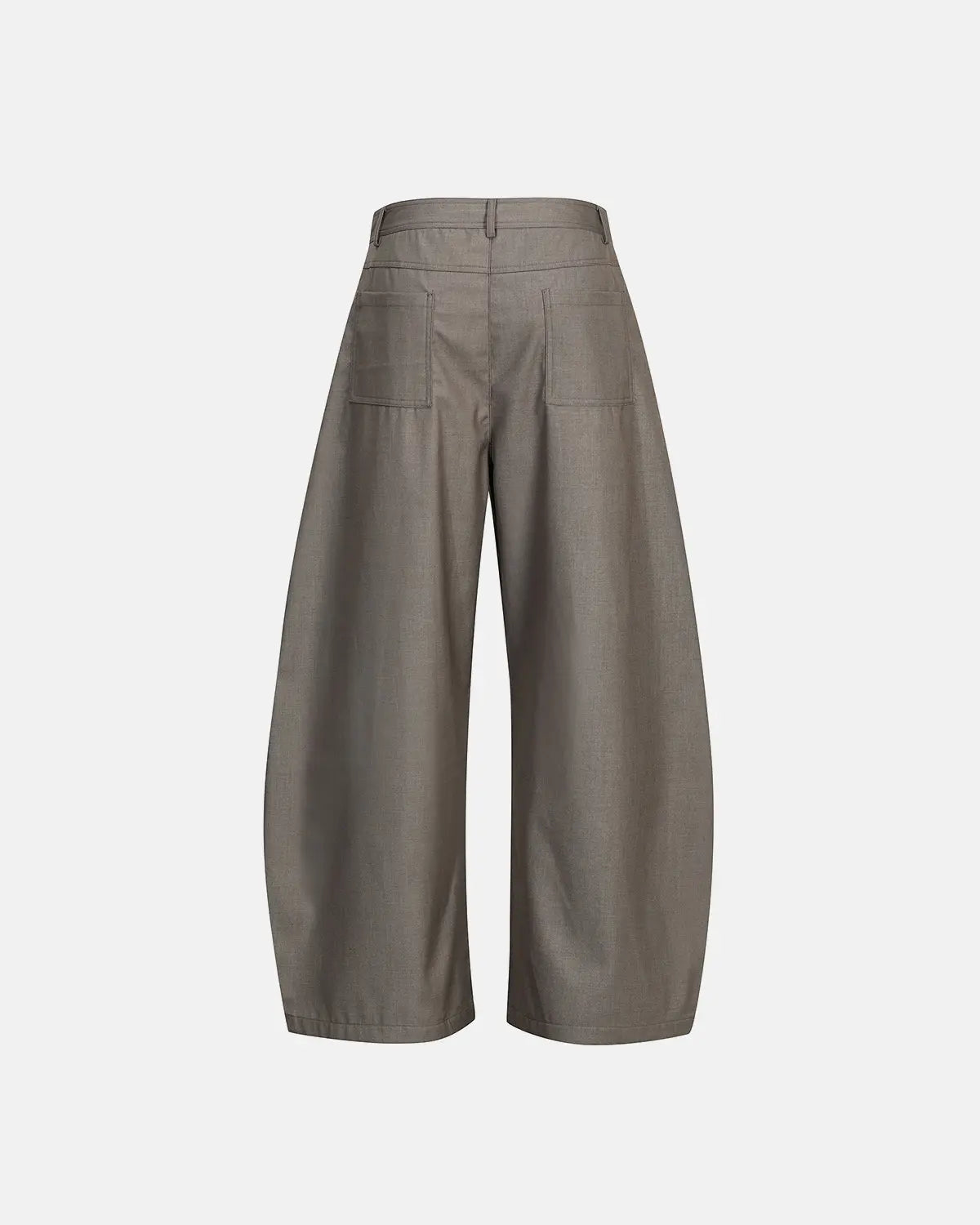 Asymmetric pleated barrel-leg suit pants by INFLATION, featuring a stylish, modern design with pleats and a relaxed fit.