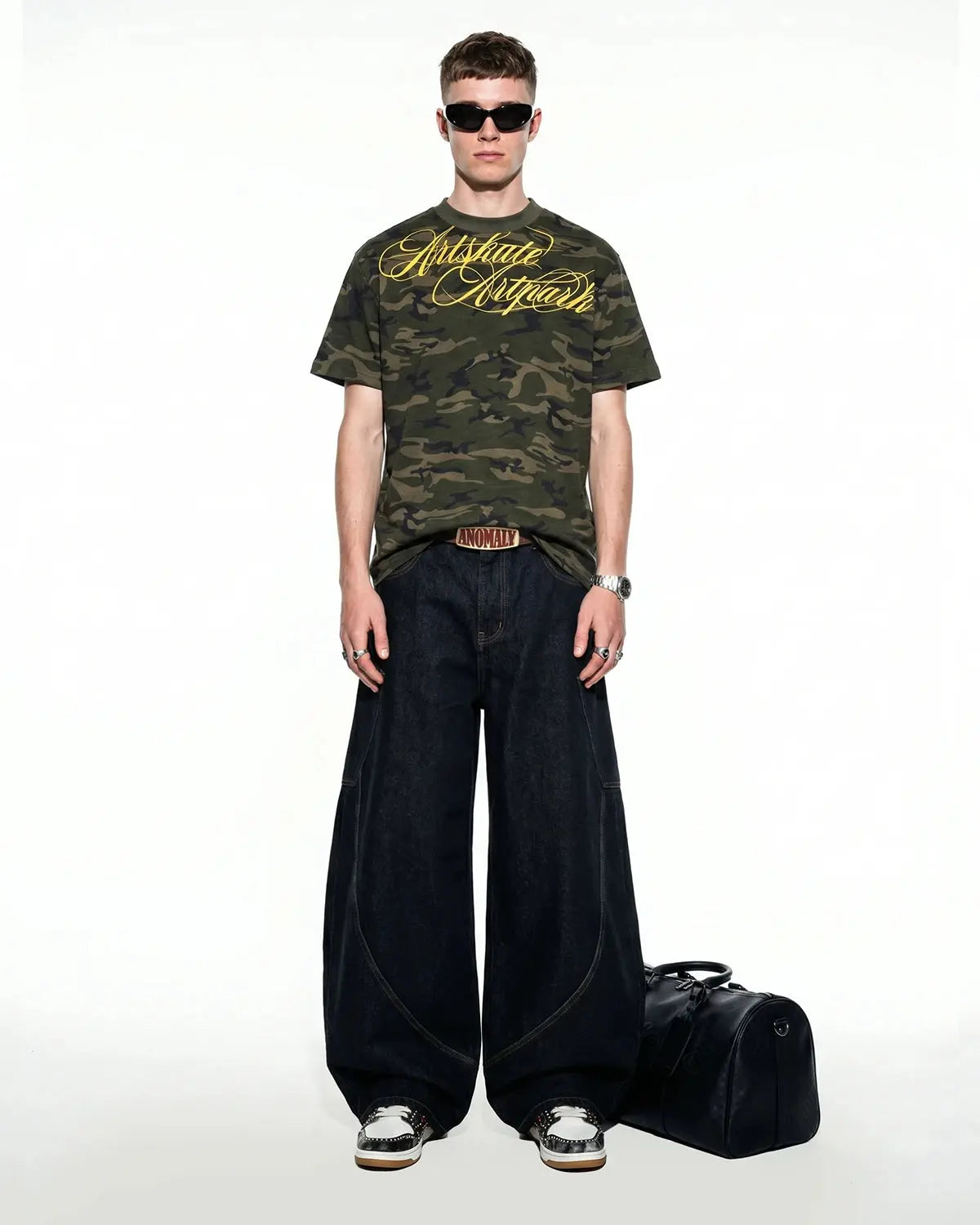 Camo Script Boxy T-Shirt by INFLATION featuring a camouflage print with stylish script logo on a relaxed fit streetwear top.