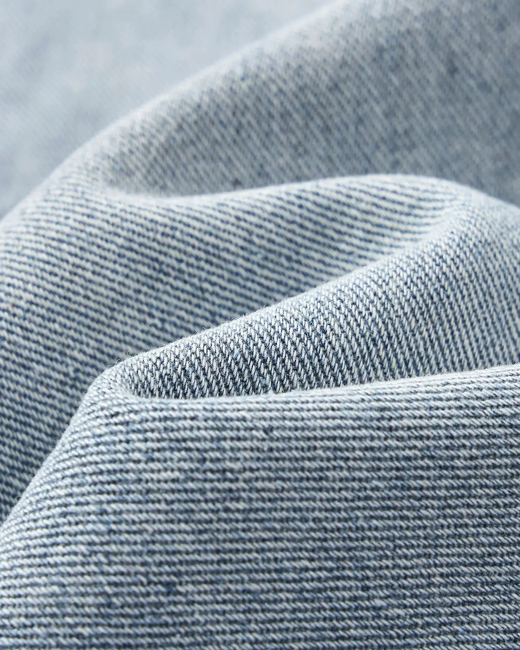 Distressed baggy cargo jeans by Flation featuring a relaxed fit, rugged design, and multiple utility pockets on light denim fabric.