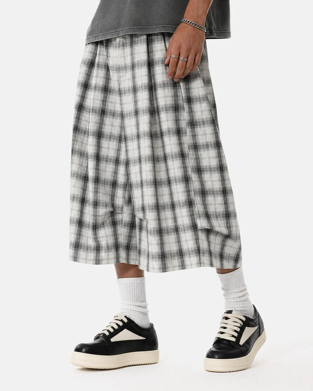 Inflation brand plaid longline casual shorts with a relaxed fit and checkered pattern, perfect for streetwear and casual wear.