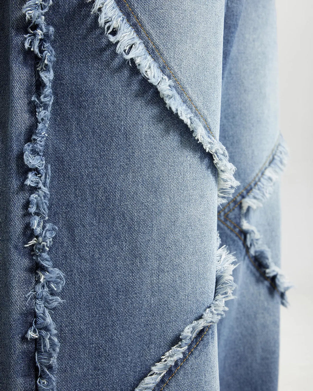 Blue frayed acid wash jeans from Inflation Streetwear featuring distressed details and a relaxed fit.