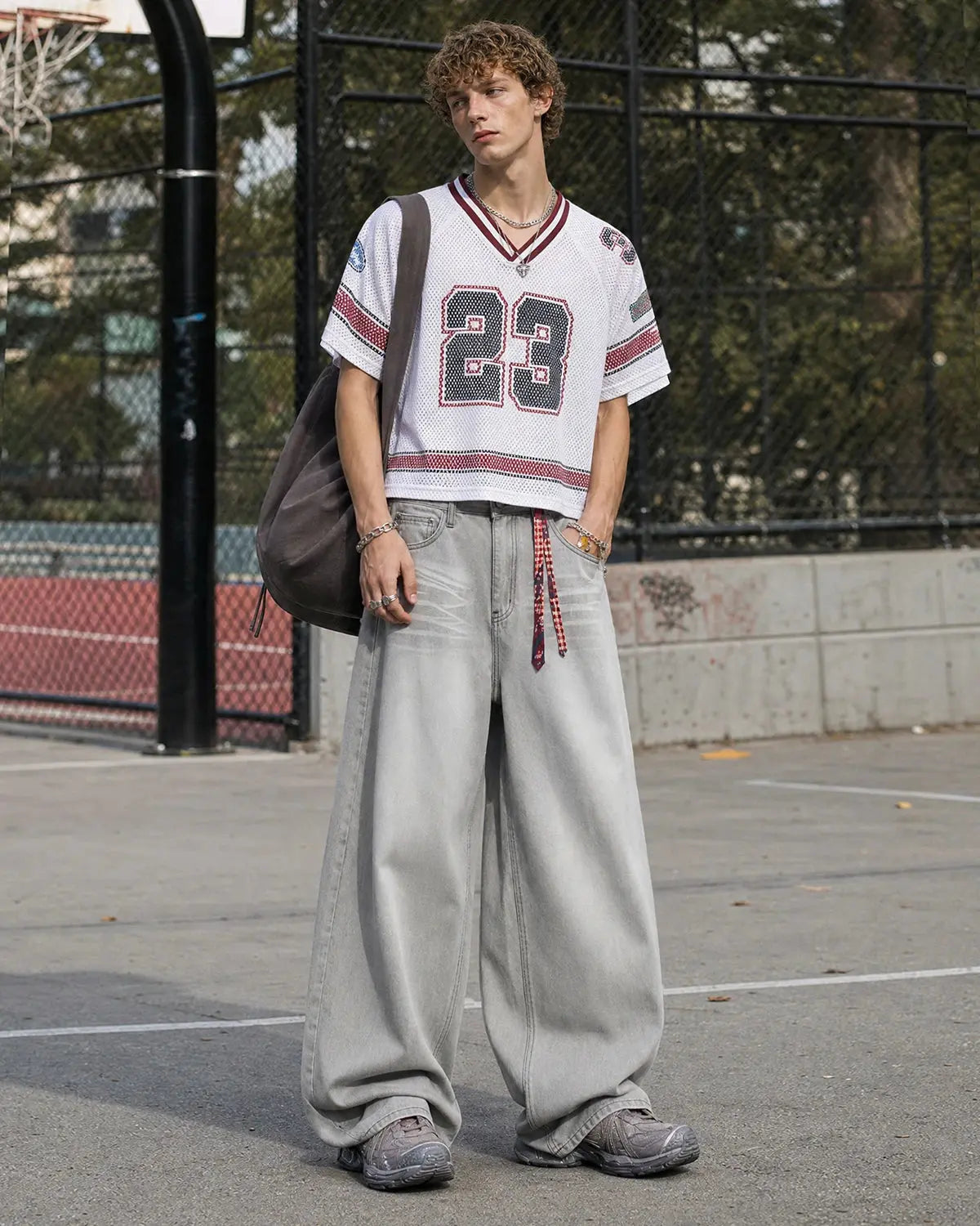 Washed distressed baggy jeans by Flation Streetwear featuring a relaxed fit, ripped details, and faded denim texture.