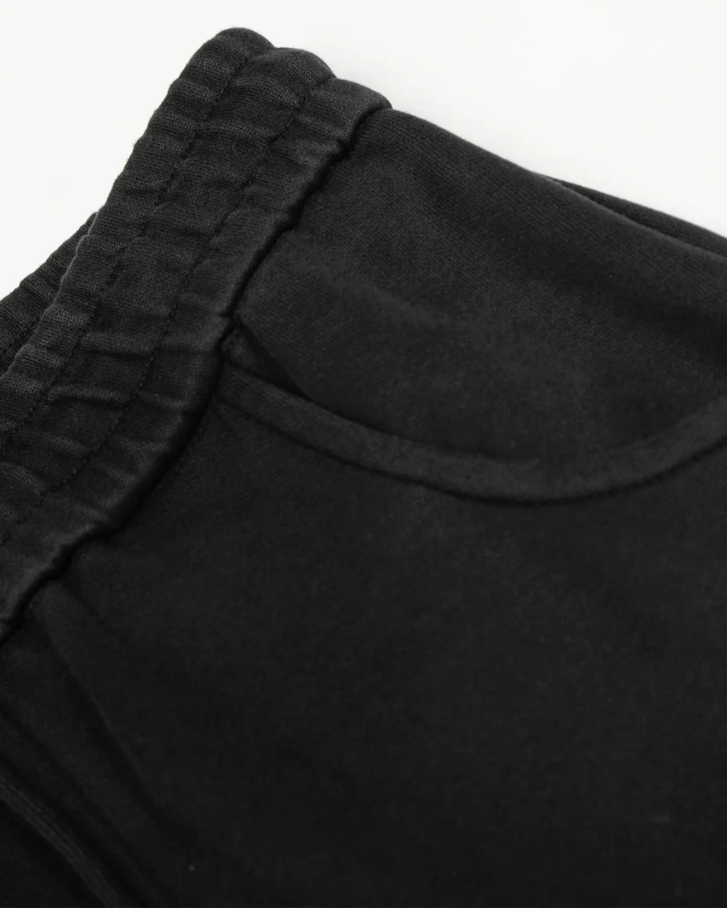 Washed distressed barrel sweatpants by INFLATION featuring a relaxed fit and faded, worn-in denim style with distressed details.