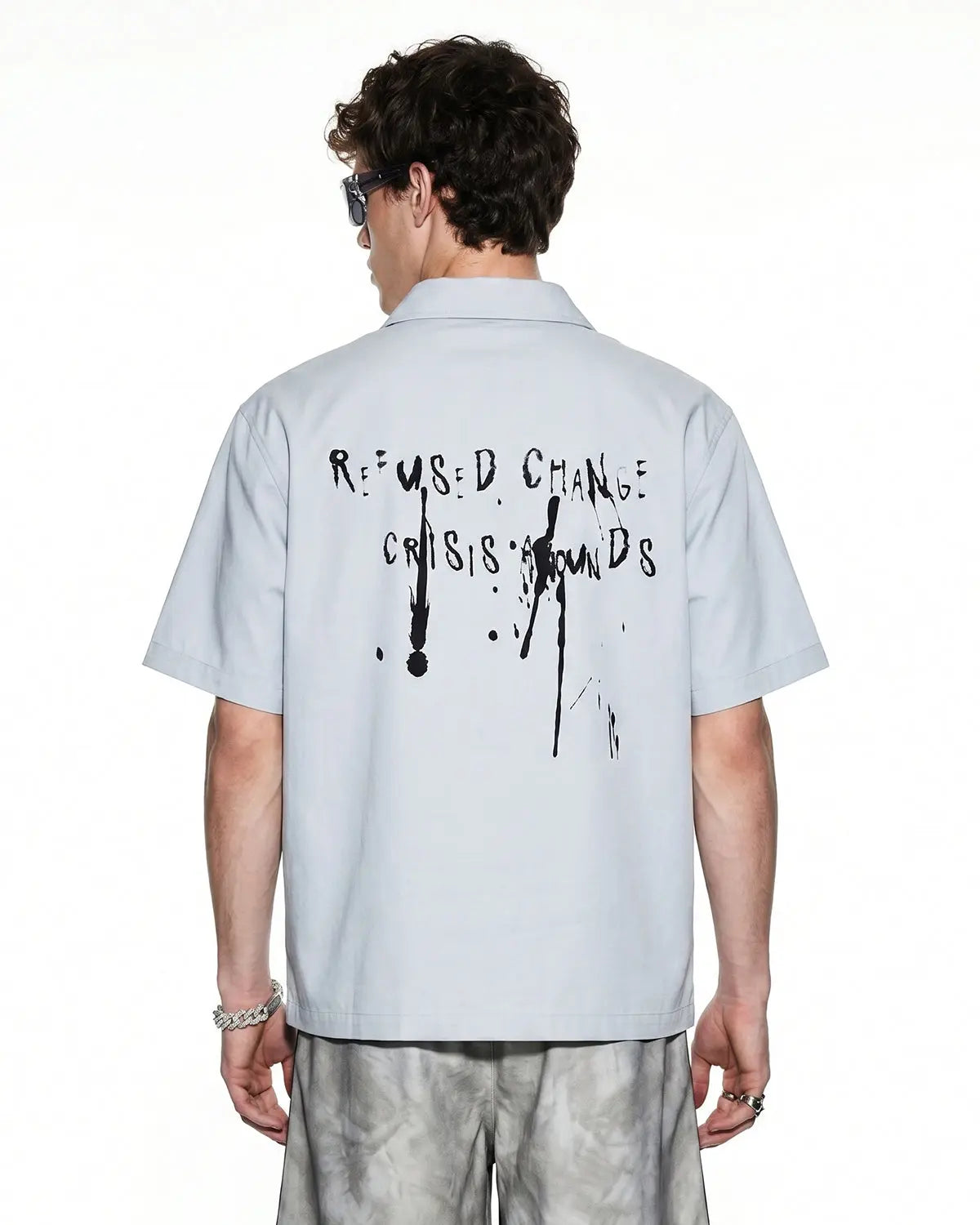 Abstract graphic printing shirt by INFLATION featuring bold, colorful geometric designs on a casual streetwear shirt.