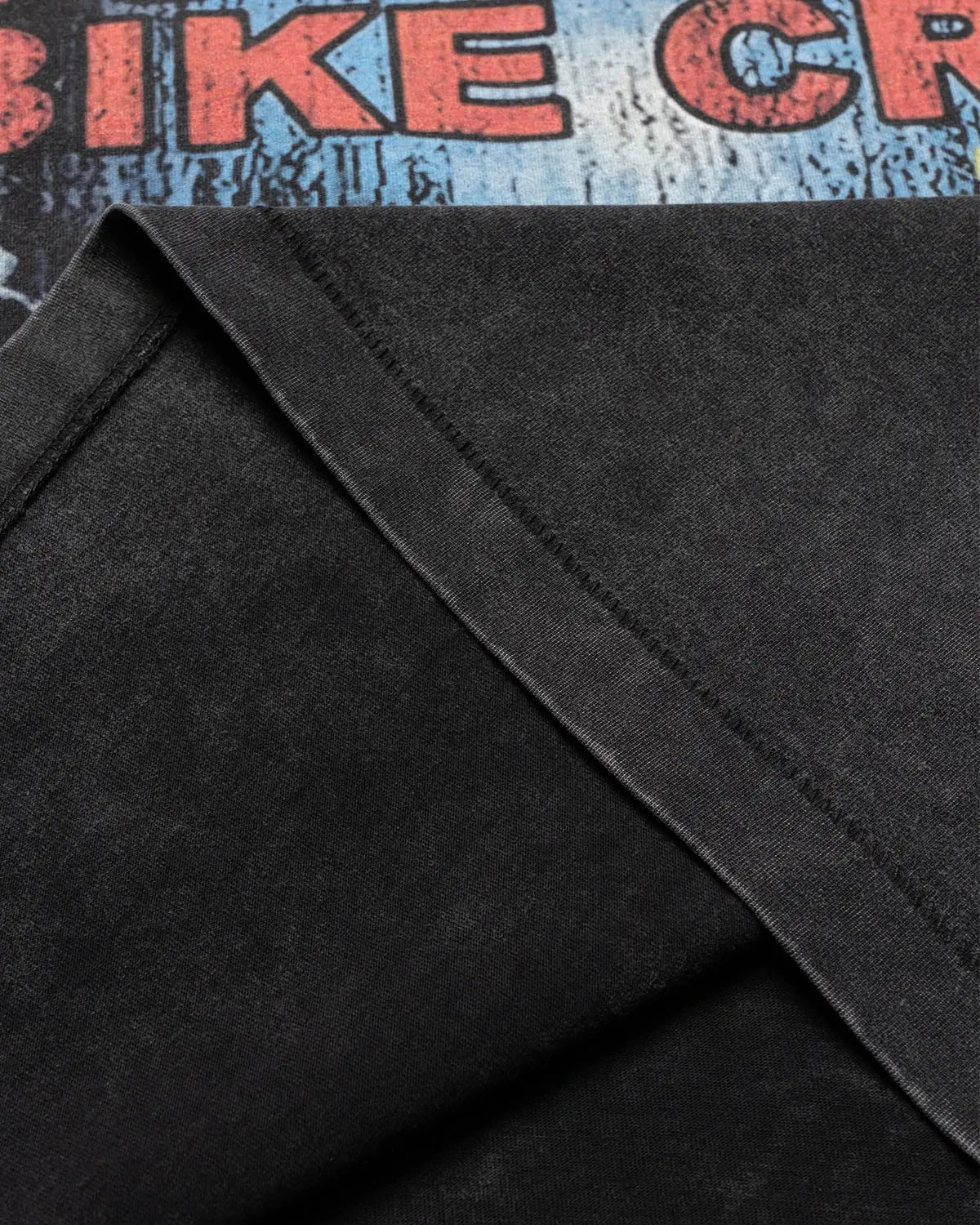 Vintage graphic snow washed T-shirt by INFLATION, featuring a retro-style print on soft, distressed fabric.