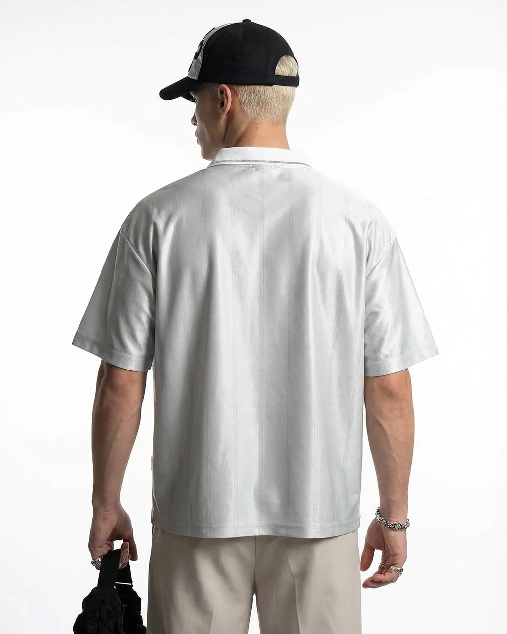 Vintage striped polo jersey by INFLATION featuring classic design and multicolor horizontal stripes on soft fabric.