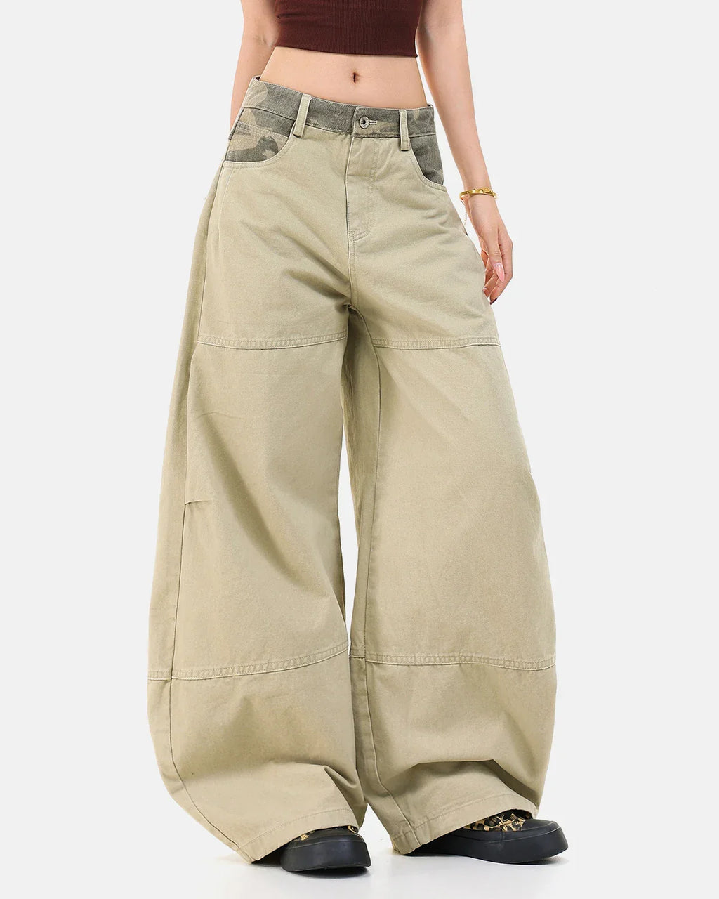 Camo patchwork barrel pants by INFLATION Streetwear featuring a relaxed fit and camouflage design in a casual style.