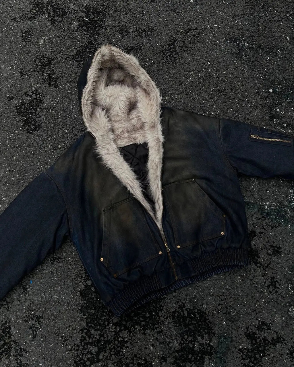 Inflation streetwear faux fur-lined acid wash bomber jacket with a relaxed fit and casual style, displayed on a hanger.