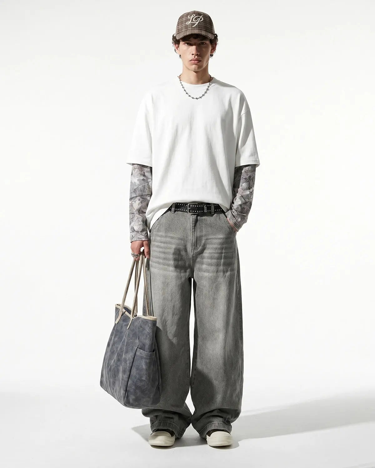 Camo layered oversized T-shirt by INFLATION Streetwear featuring camouflage print and relaxed fit, shown on a mannequin.