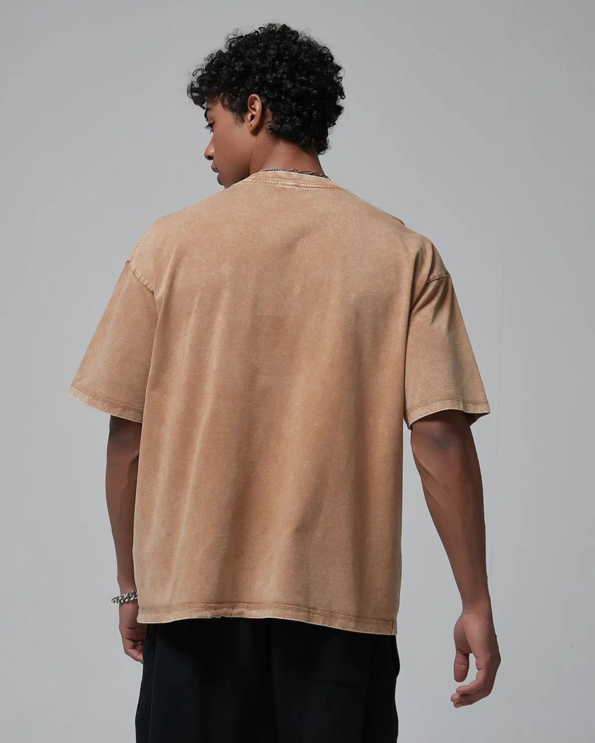 Wax washed mock neck t-shirt by INFLATION featuring a casual streetwear style, shown in a close-up of the fabric and neckline.