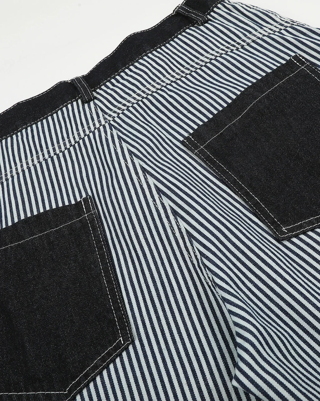 Inflation Streetwear striped patch pocket baggy jeans featuring relaxed fit and bold striped pattern for casual street style.