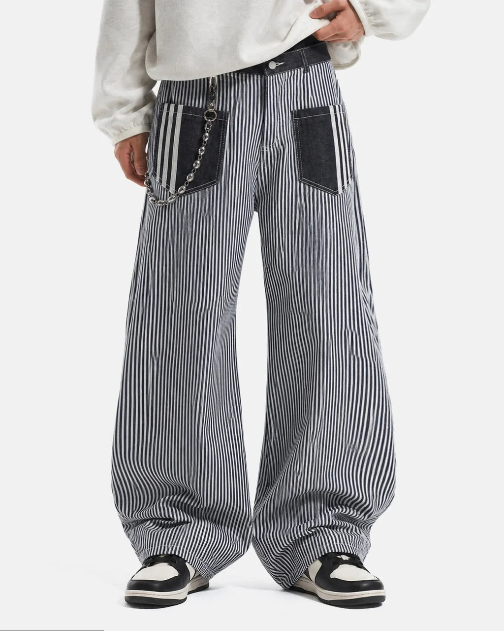 Inflation Streetwear striped patch pocket baggy jeans with relaxed fit and bold stripe pattern, showcasing front pockets and denim texture.