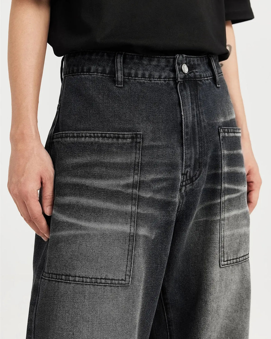 Black washed baggy jeans from Flation Streetwear, featuring relaxed fit and distressed denim style.