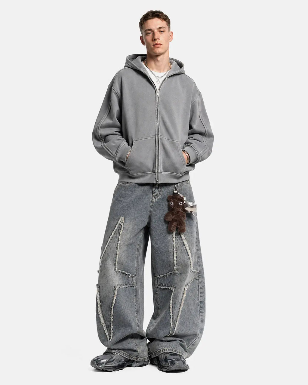 Star patched baggy jeans by Flation Streetwear featuring distressed denim, relaxed fit, and star patch details.
