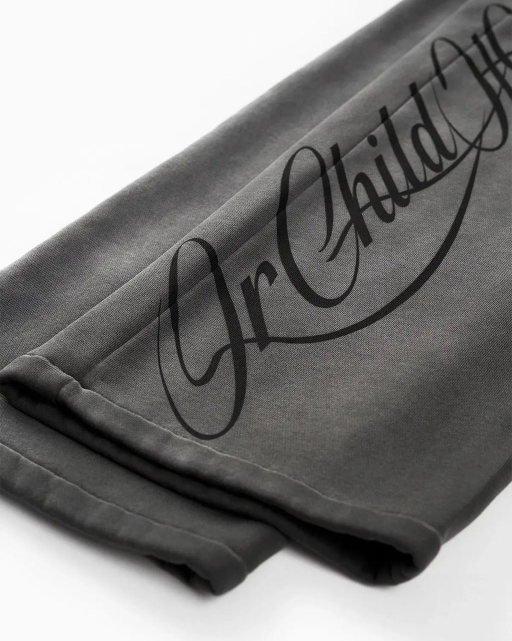 Acid washed Flation Streetwear sweatpants with relaxed fit and drawstring waist, showcasing casual style and textured fabric.