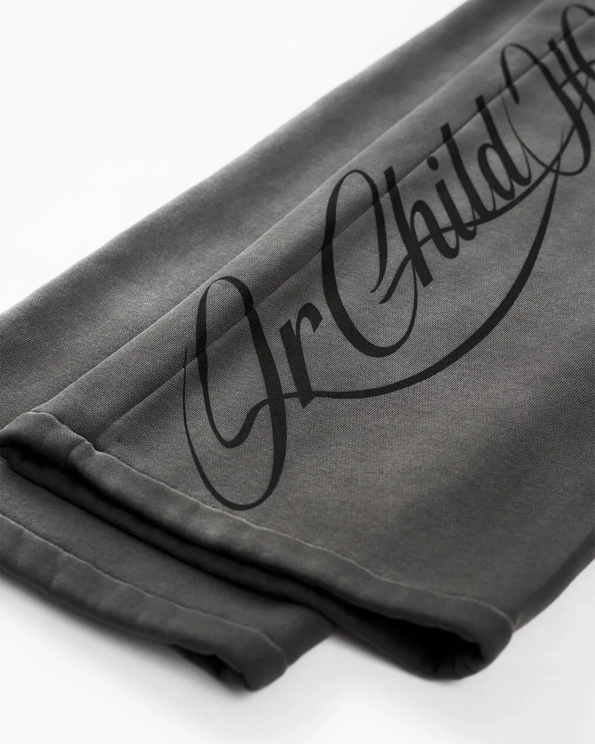 Acid washed Flation Streetwear sweatpants with relaxed fit and drawstring waist, showcasing casual style and textured fabric.