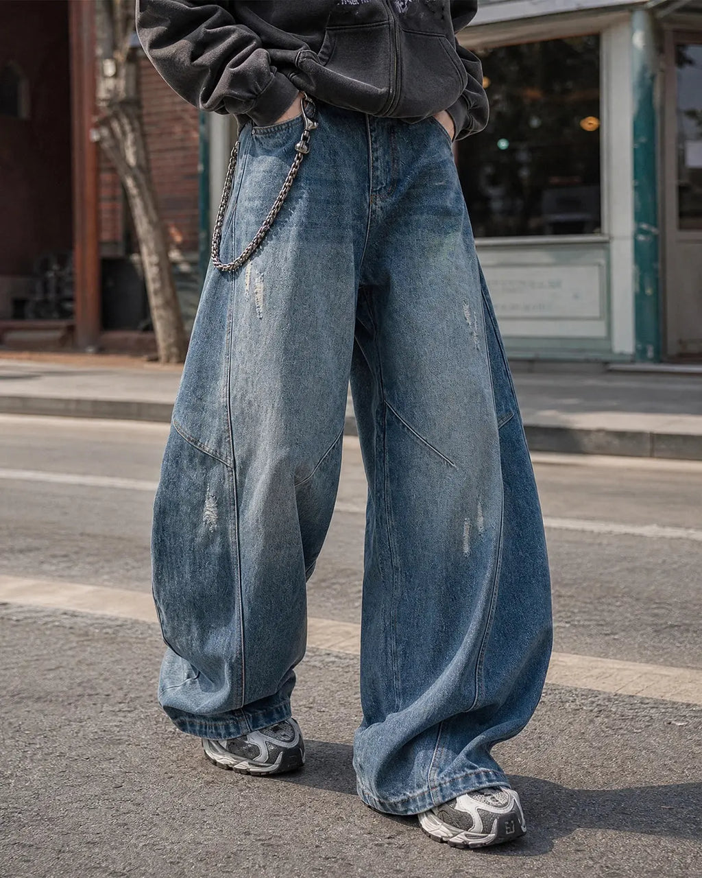 Distressed ripped baggy jeans by Flation, casual streetwear pants with a relaxed fit and rugged, distressed details.