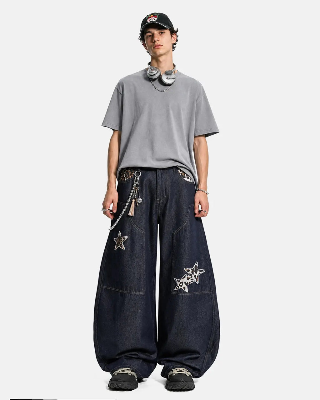 Inflation Streetwear leopard star patch barrel jeans showing the distressed denim with star patches and leopard print accents.
