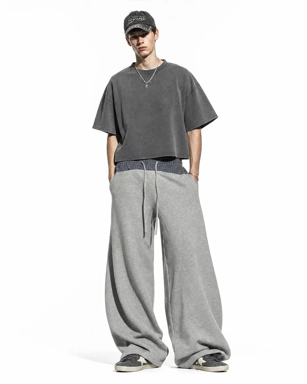 Plaid layered baggy sweatpants from INFLATION Streetwear with a relaxed fit and layered design, featuring a plaid pattern.