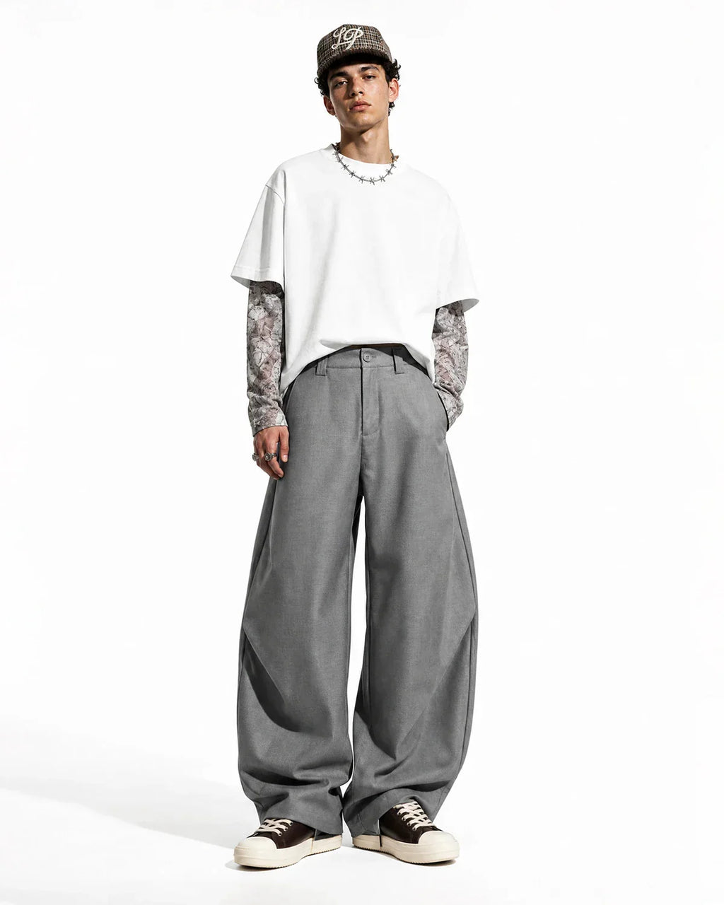 Flation pleated barrel tailored pants in neutral color, featuring a high waist, pleats, and tapered leg for a stylish streetwear look.
