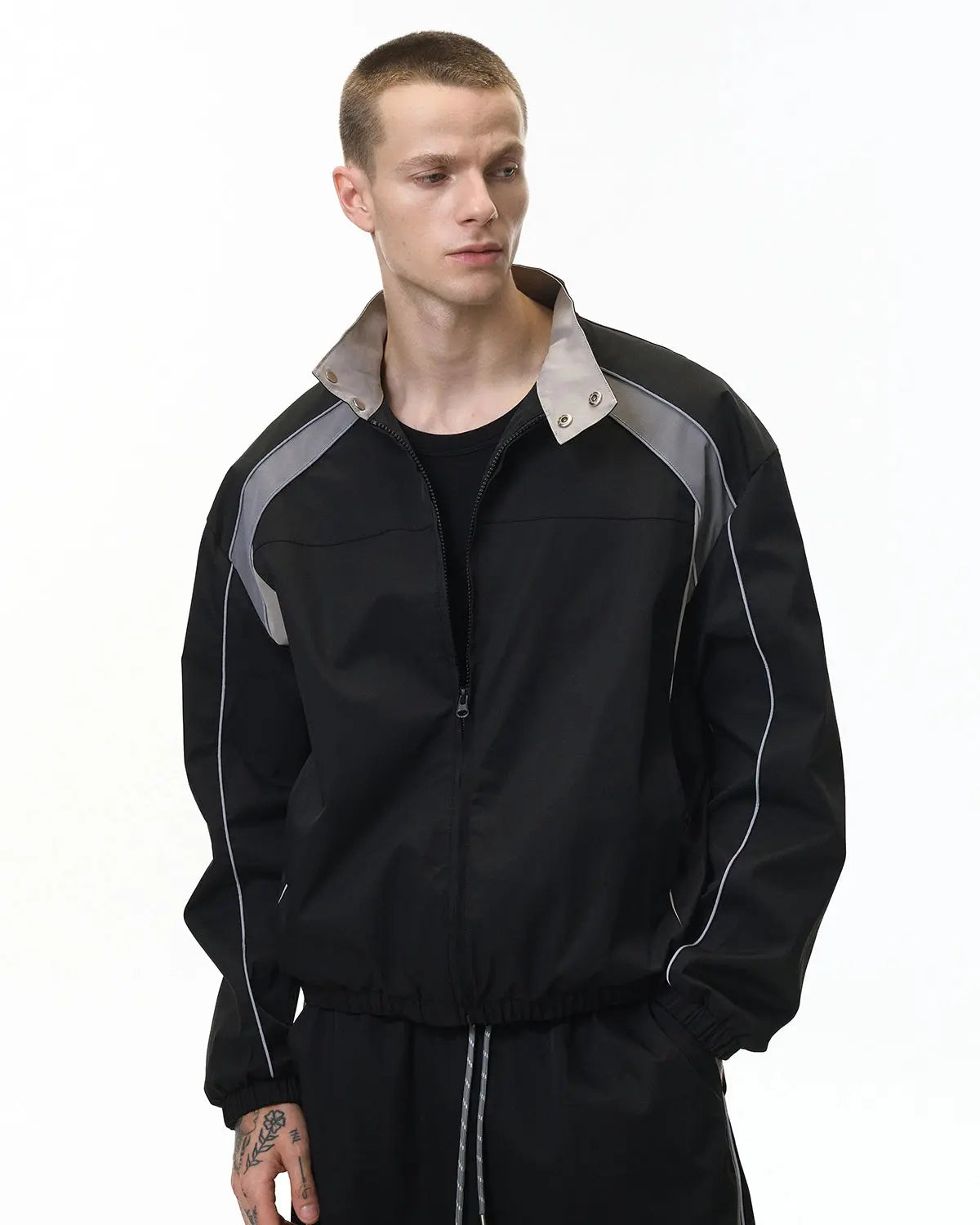 Reflective Flation streetwear windbreaker track jacket with reflective accents, lightweight and sporty for active outdoor wear.