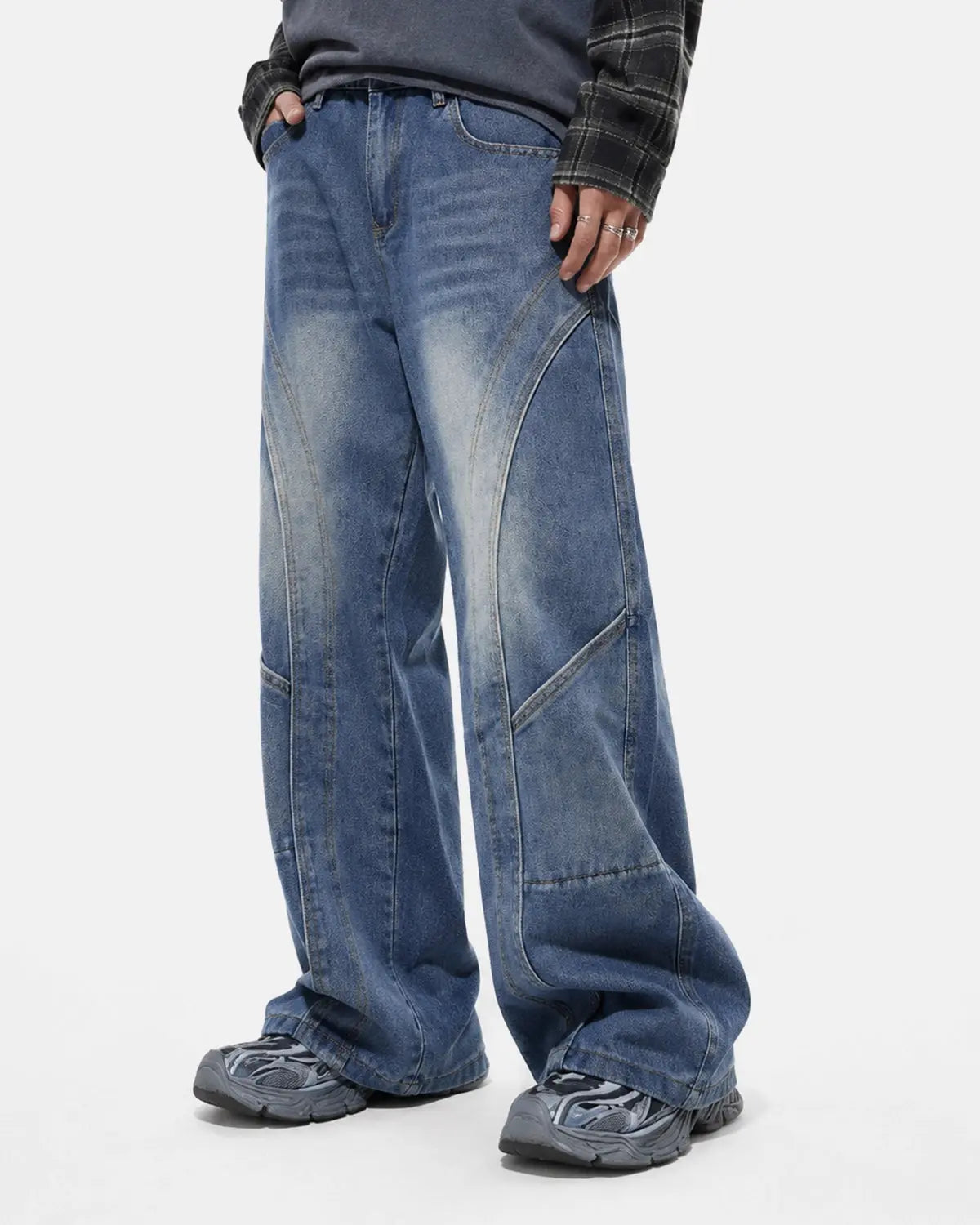 Inflation Deconstructed Baggy Straight-Leg Jeans showing relaxed fit, light wash denim, and distressed details on a model.