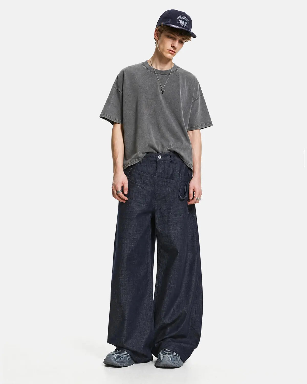 Inflation Streetwear asymmetric wrap waist baggy jeans with relaxed fit and unique design, featuring a loose, casual style.
