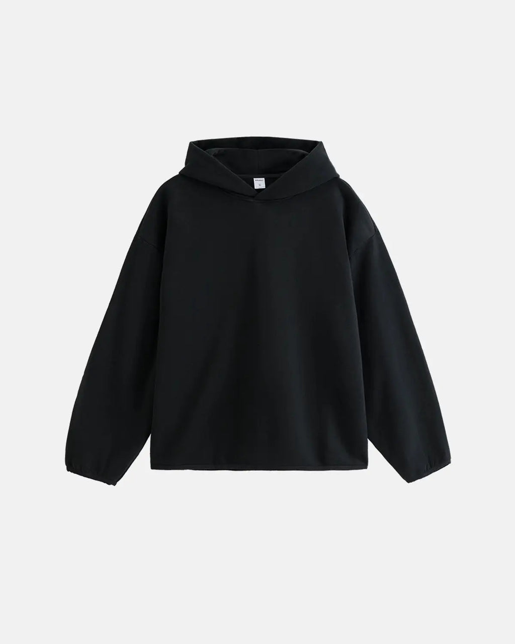 Black premium velvet hoodie by Flation Streetwear, featuring a soft texture and relaxed fit, shown on a model.