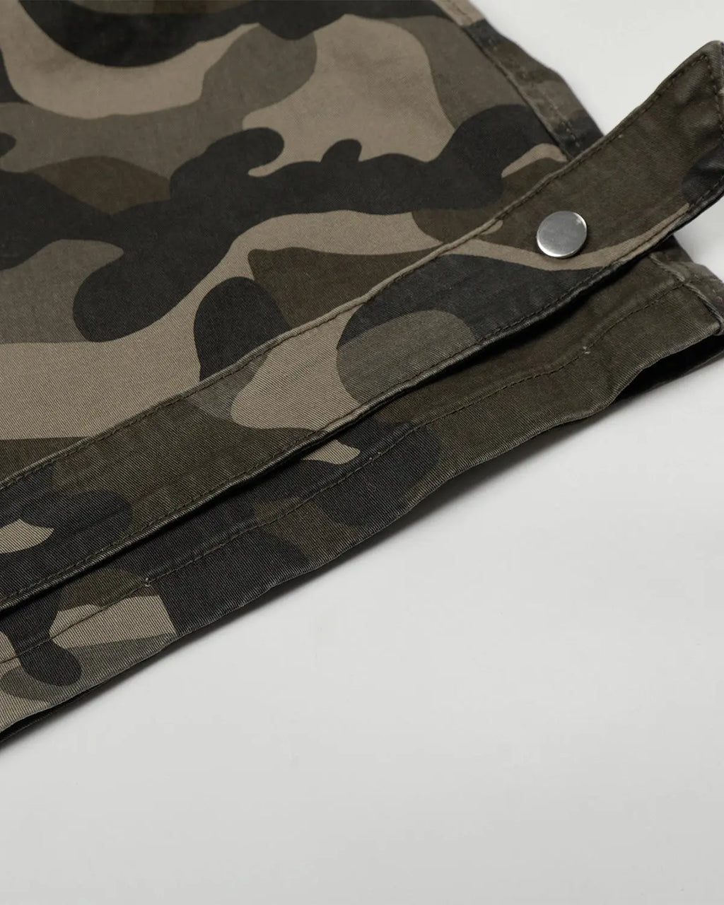 Inflation Streetwear camo barrel cargo pants with multiple pockets, relaxed fit, and military-style camouflage print.