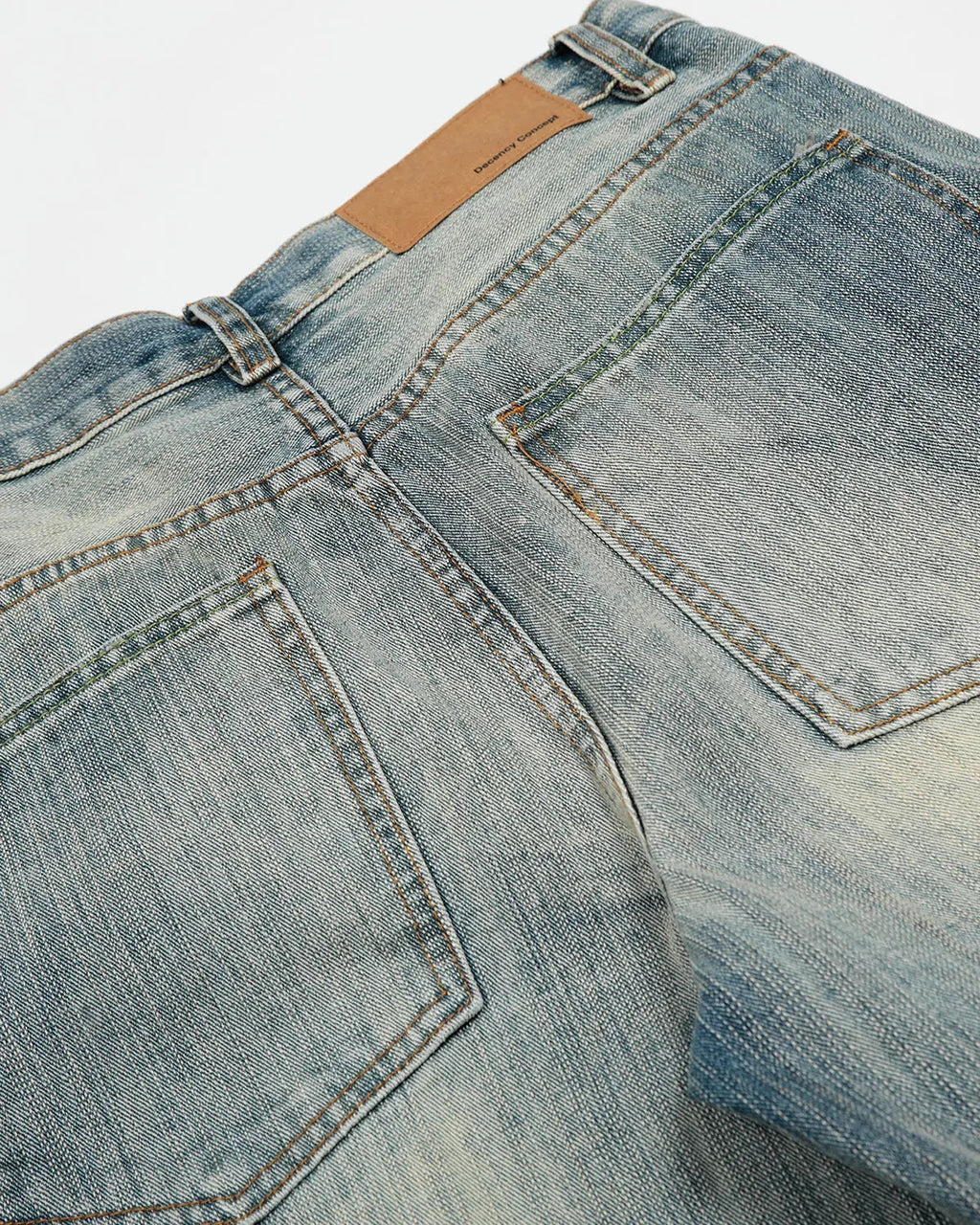 Distressed bamboo weave baggy jeans by INFLATION Streetwear featuring relaxed fit and unique textured fabric.