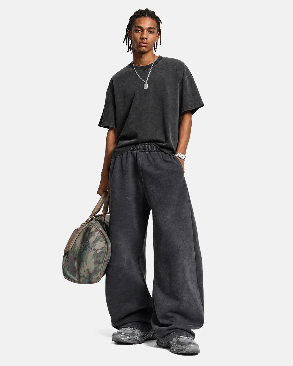 Washed graphic wide-leg sweatpants by Inflation Streetwear featuring relaxed fit, bold graphic design, and casual streetwear style.