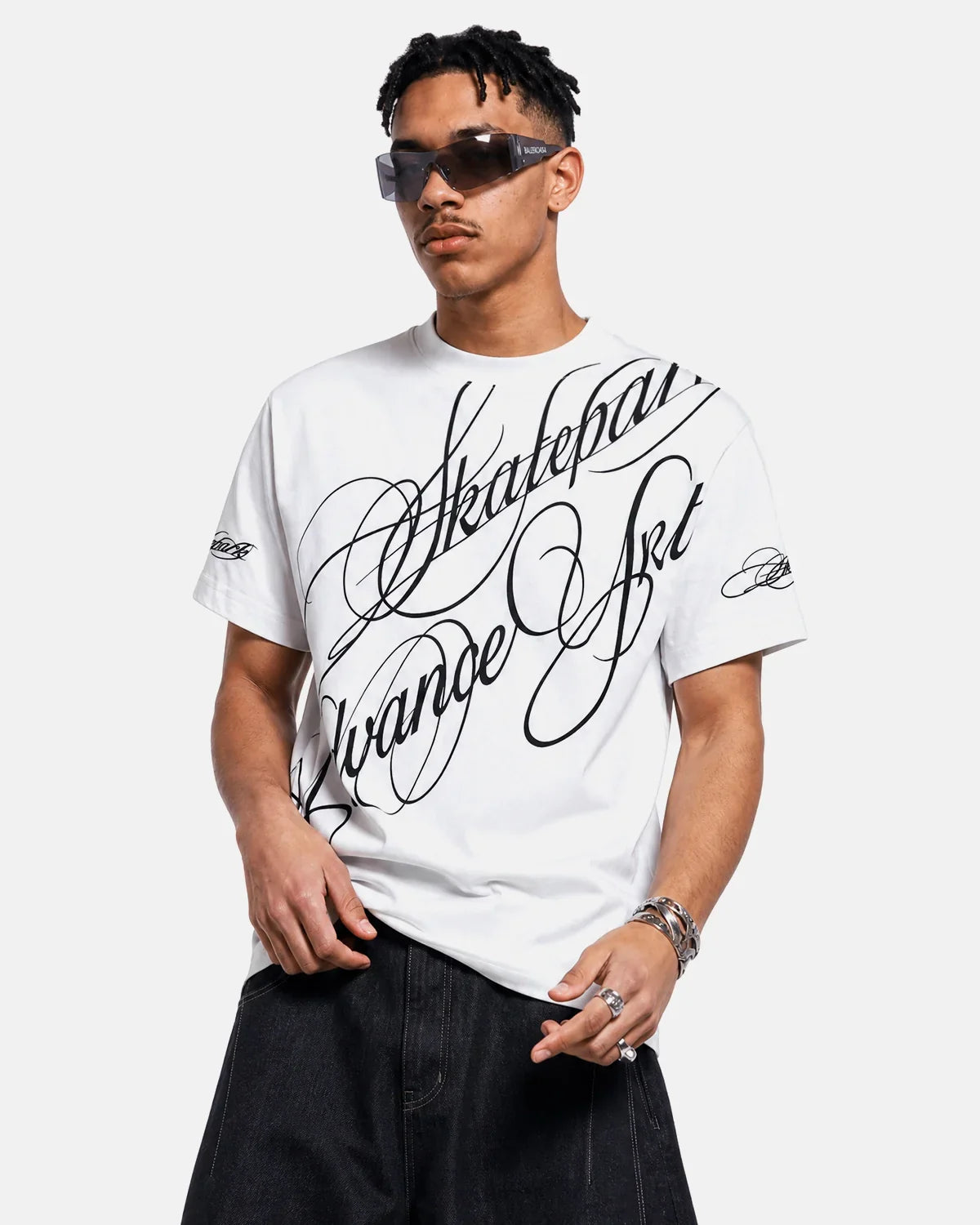 Inflation Streetwear All-Over Script Graphic T-Shirt featuring bold black lettering on a white fabric background.