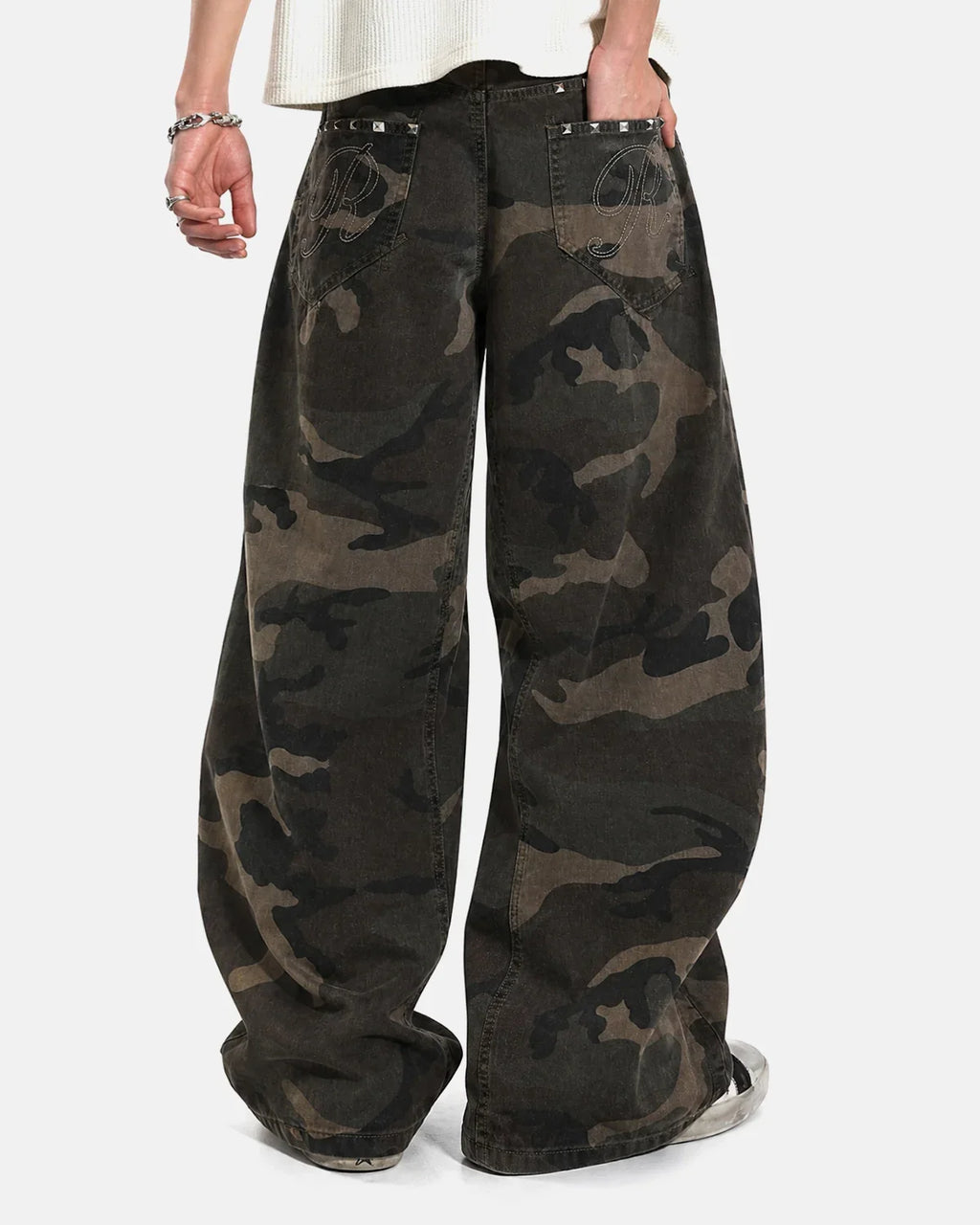 Inflation Streetwear studded camo barrel jeans with metal embellishments and distressed details, showcasing a trendy streetwear pants style.