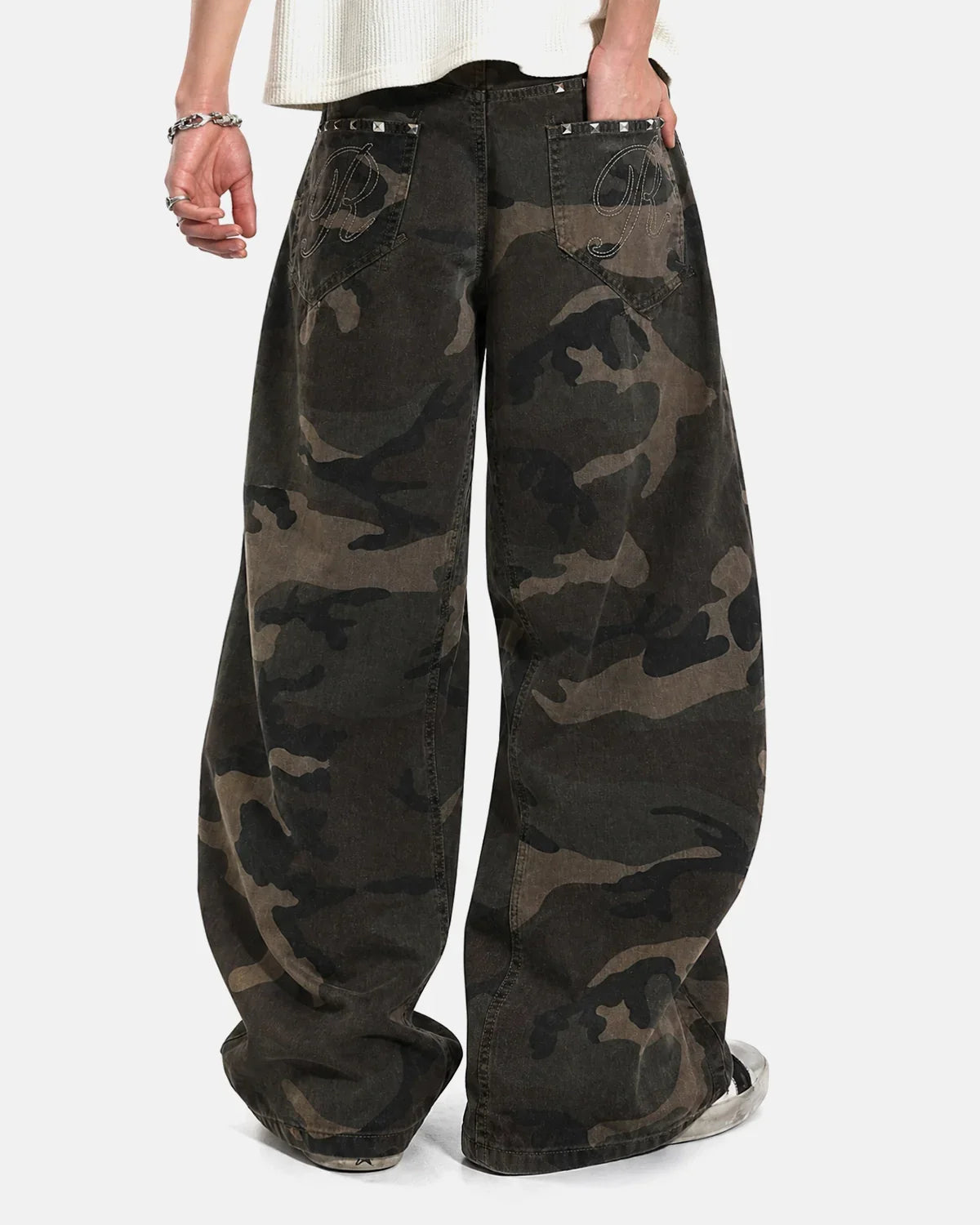 Inflation Streetwear studded camo barrel jeans with metal embellishments and distressed details, showcasing a trendy streetwear pants style.