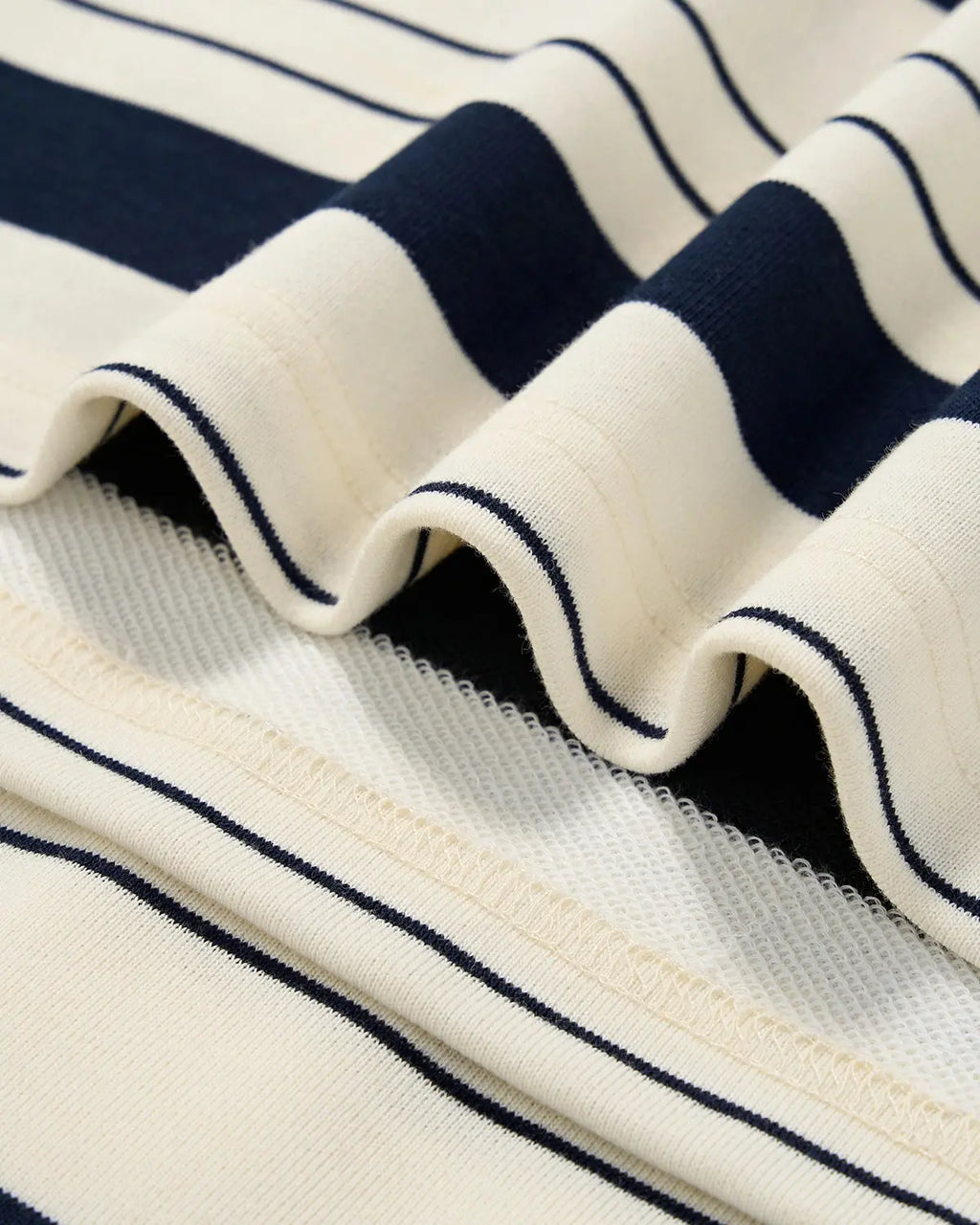 Striped rugby polo shirt by Flation Streetwear, casual t-shirt with bold stripe pattern and classic collar, front view.