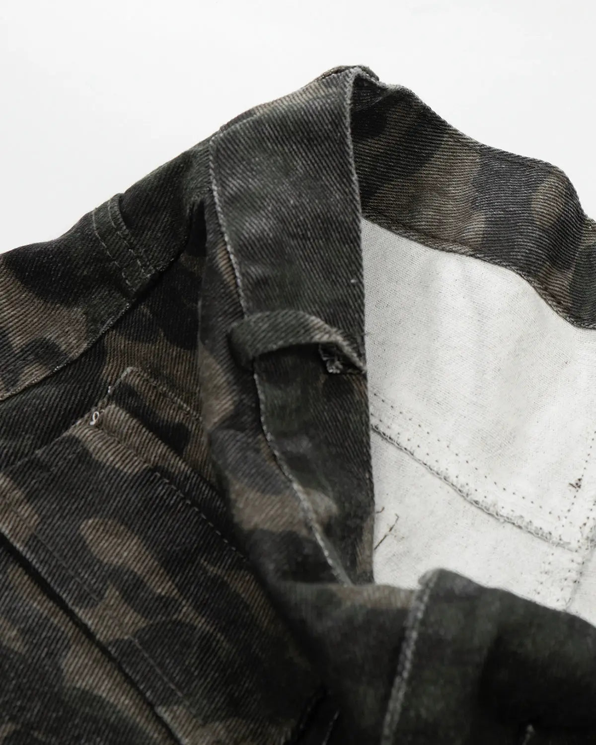Inflation streetwear camo cargo pants with multiple pockets, featuring a rugged military-inspired design and adjustable waistband.