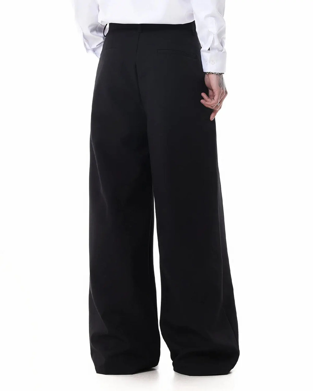 Inflation Streetwear wide-leg metal hook suit pants displayed on a model, showcasing the stylish, high-waisted design and textured fabric.
