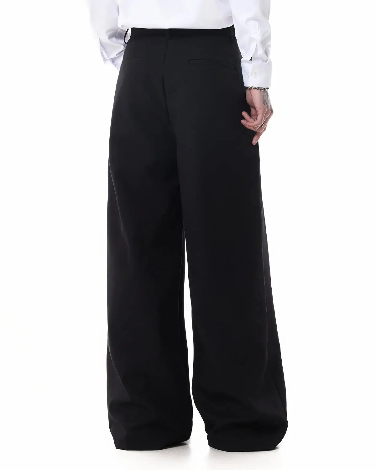 Inflation Streetwear wide-leg metal hook suit pants displayed on a model, showcasing the stylish, high-waisted design and textured fabric.