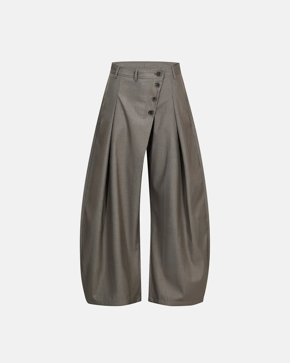 Asymmetric pleated barrel-leg suit pants by INFLATION, showcasing stylish tailored design and unique pleats on a modern fashion model
