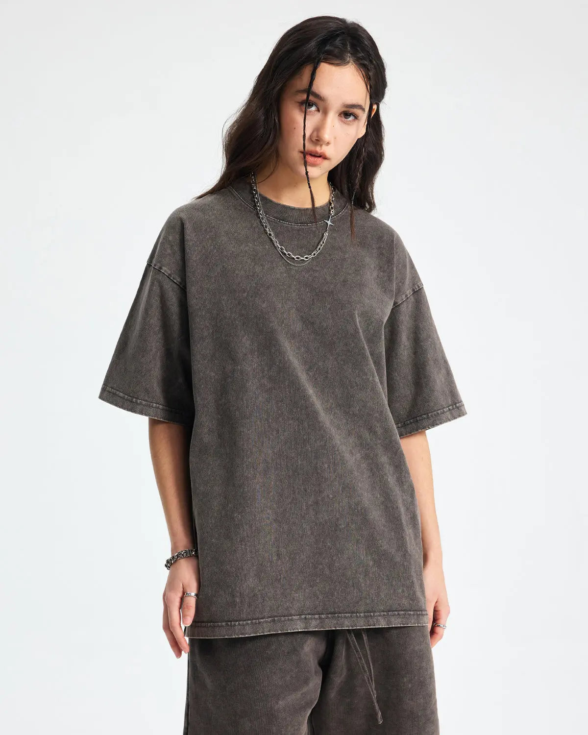 Inflation Snow Washed Oversized T-Shirt in light fabric, featuring a relaxed fit and streetwear style, displayed on a hanger.