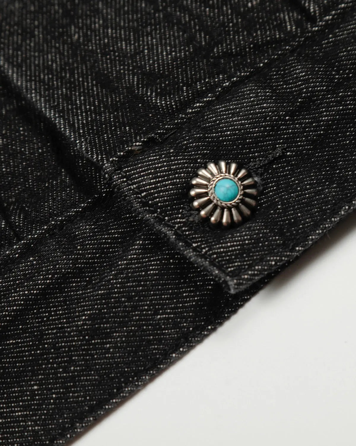 Raw Clasp denim jacket by INFLATION featuring classic blue denim, button closures, and a structured collar on a model.