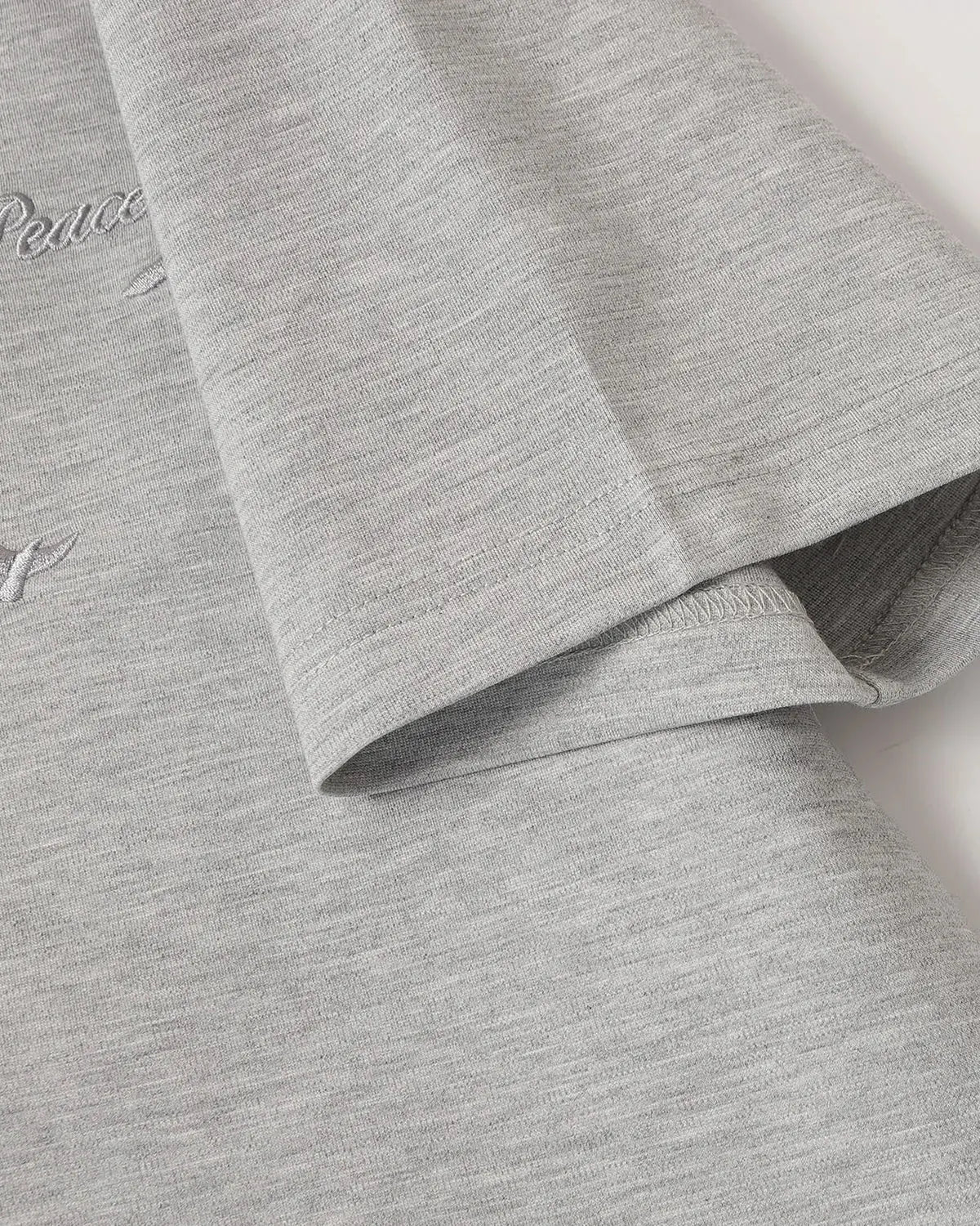Inflation Streetwear Dove embroidered mock neck T-shirt featuring detailed embroidery on a comfortable, stylish black fabric.