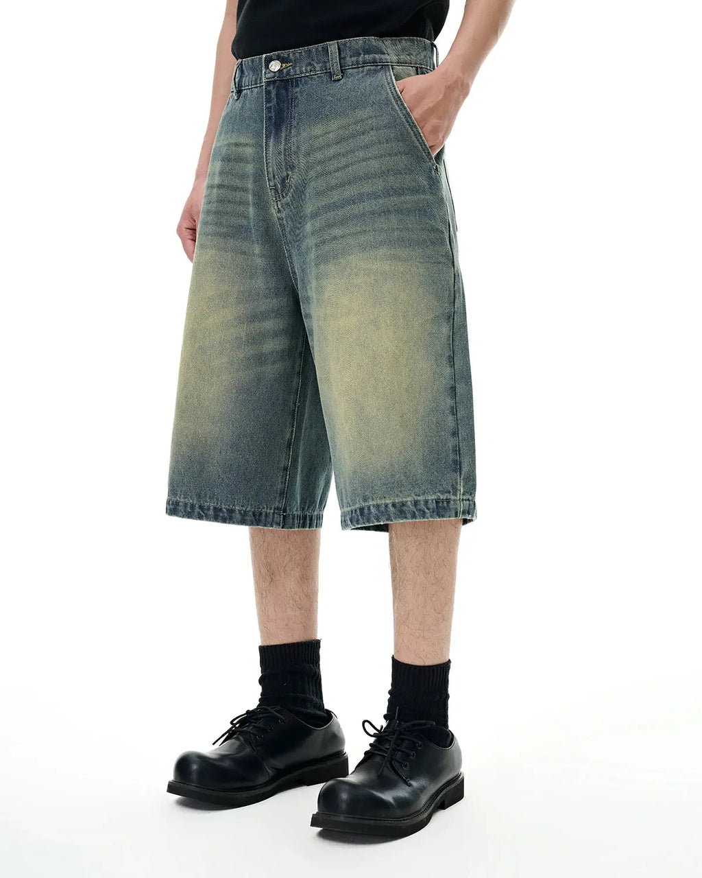 Pair of Flation Retro Washed Denim Shorts, stylish jorts with distressed details and rolled hems, on a neutral background.