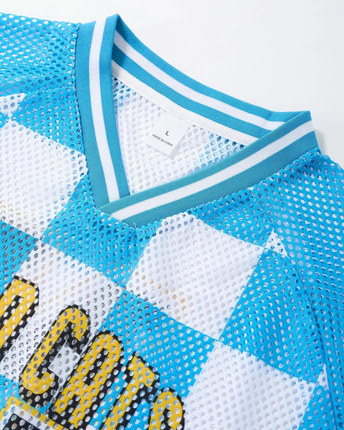 Inflation Streetwear varsity checkerboard mesh jersey with black and white pattern, lightweight and breathable fabric.